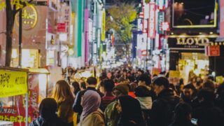 people walking on street during nighttime