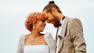 a man and a woman standing next to each other