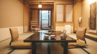 brown wooden table near window