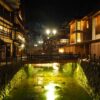 a river running through a city at night