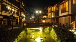 a river running through a city at night