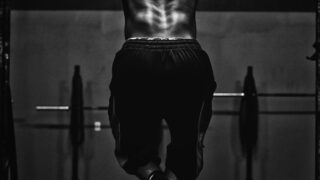 grayscale photo of man working out