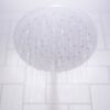 water from round gray stainless steel shower head