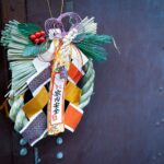 red and green ribbon on black wooden wall