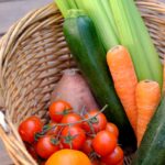 carrots and cucumber on brown woven basket