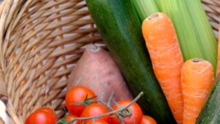 carrots and cucumber on brown woven basket