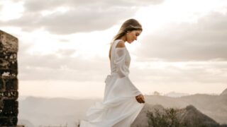 woman in white long-sleeved dress