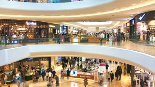 a mall filled with lots of people walking around